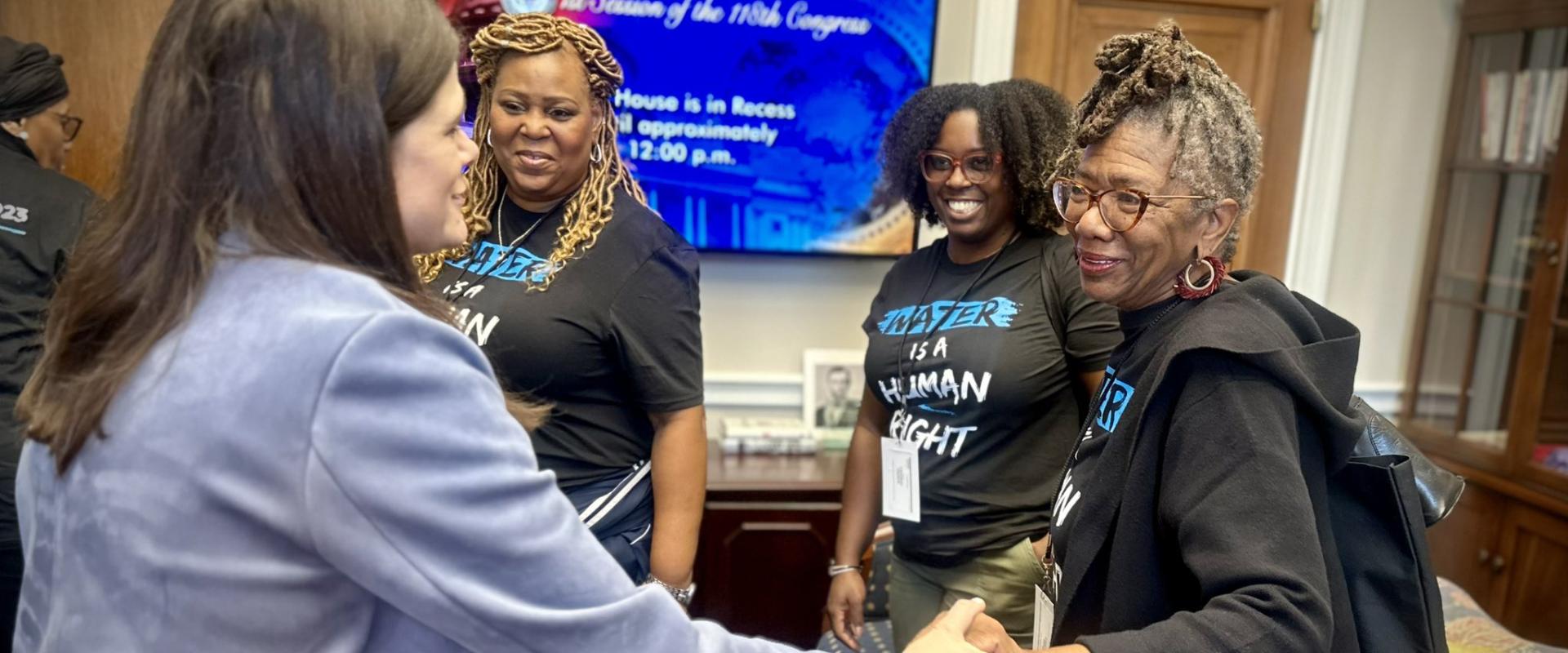 Rep. Haley Stevens share a moment with constituents