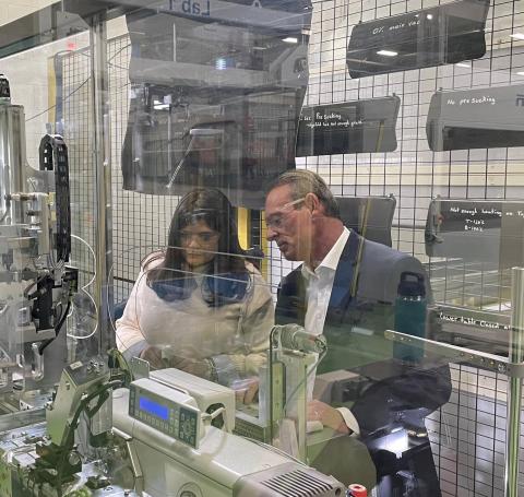 Rep. Haley Stevens listens to an expert describe their production facility 