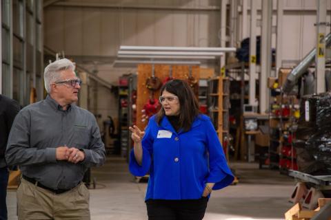 Rep. Stevens asks an expert a question at the Technical and Engineering Center in Auburn Hills