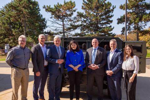 Rep. Stevens stands with experts outside the AM General Technical and Engineering Center 