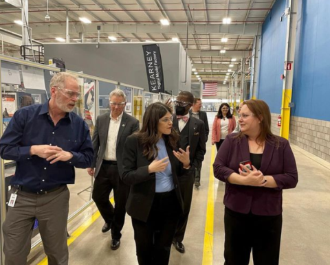 Congresswoman Stevens speaking with people at the Composites Institute Scale-Up Research Facility
