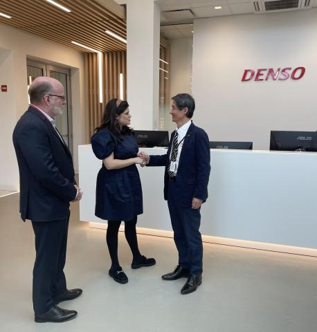 Rep. Haley Stevens shakes hands with DENO's North American Regional CEO, Tomoyuki Arakawa