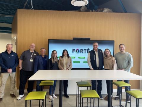 Rep. Stevens (center) stands with Forte employees for a photo