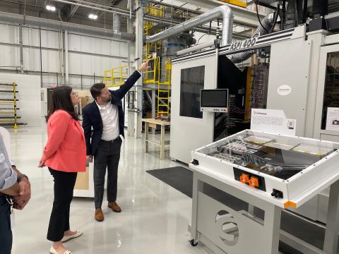 An expert shows Rep. Stevens the factory floor