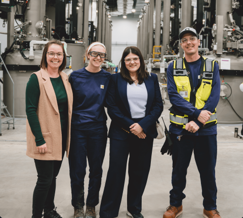 Rep. Stevens stands with three experts at Hemlock's Corning Wafer facility