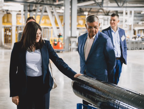 Rep. Stevens examines a piece of equipment at the Corning Wafer Facility 