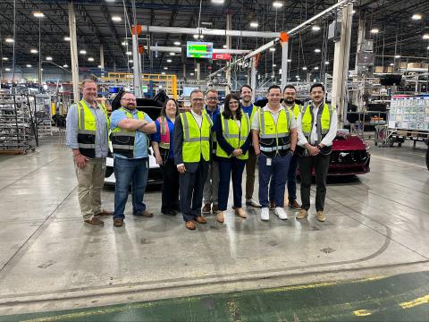 Rep. Stevens (center) stands among experts at the Webasto plant in Plymouth, MI 