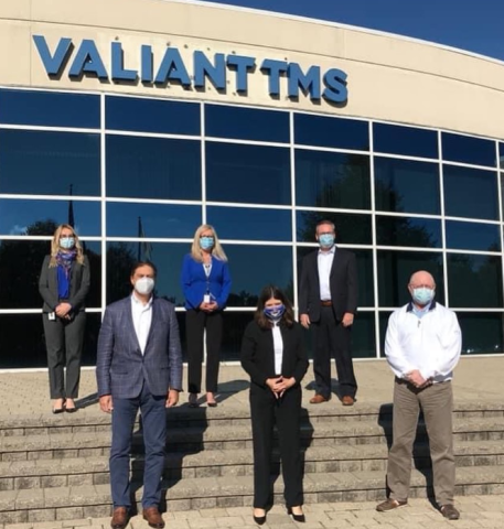 Congresswoman Stevens in front of Valiant TMS with employees