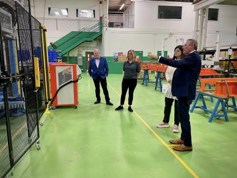 Experts at 3Con show Rep. Haley Stevens their facility in Wixom